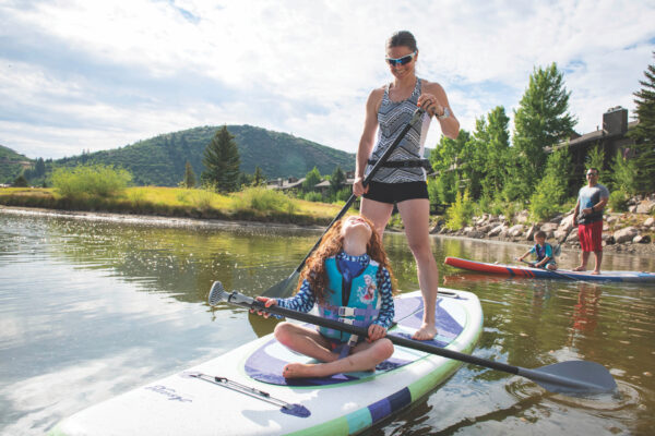 Mother and Daughter on Stand Up Paddle Board